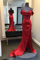 A red corset evening dress with an off-the-shoulder neckline and ruched mermaid silhouette